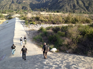 Azusa Police Officers search riverbed
